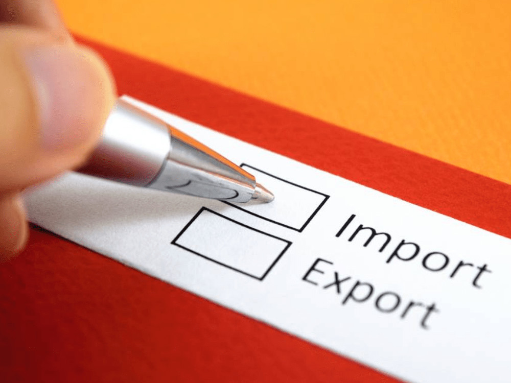 Importing into Spain decision – man choosing import or export with Spanish flag colors, guided by Xaviour Holding
